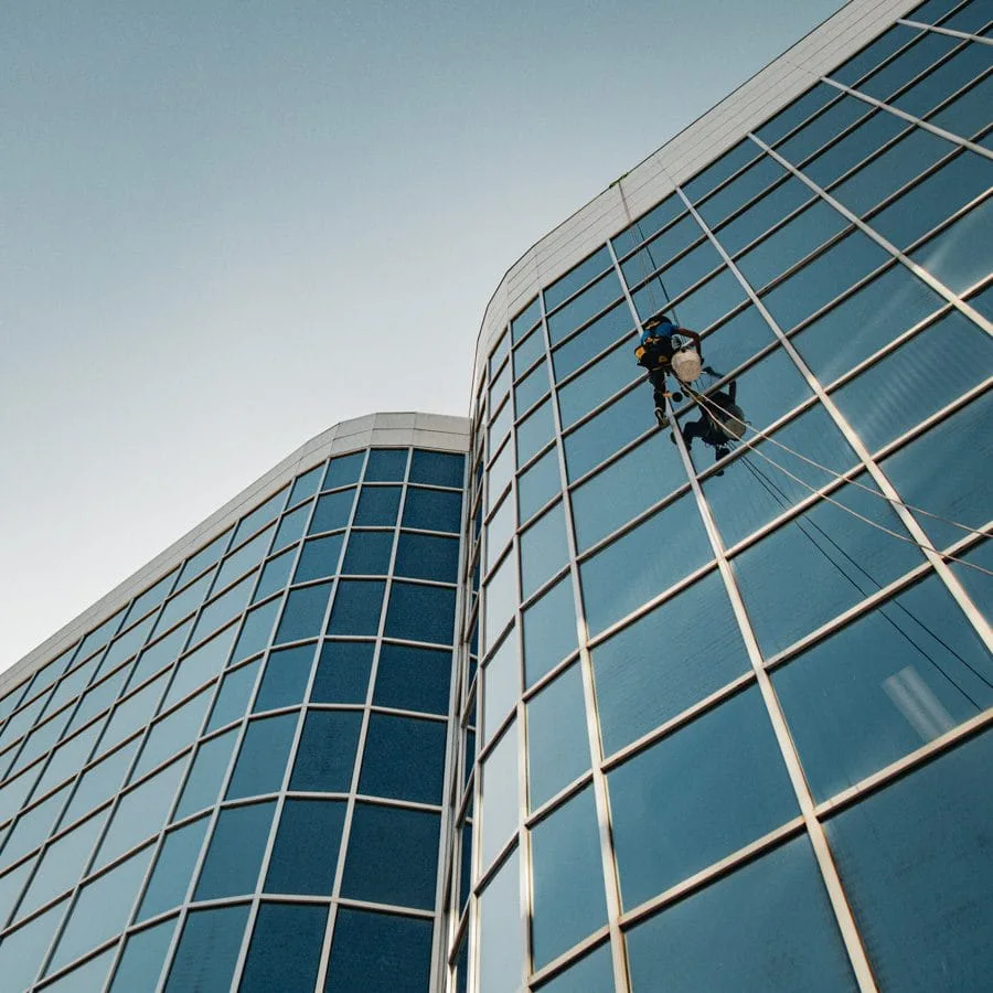 TowerCrest rope access technician cleaning exterior glass