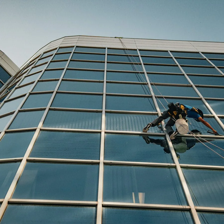 TowerCrest rope access technician cleaning exterior glass