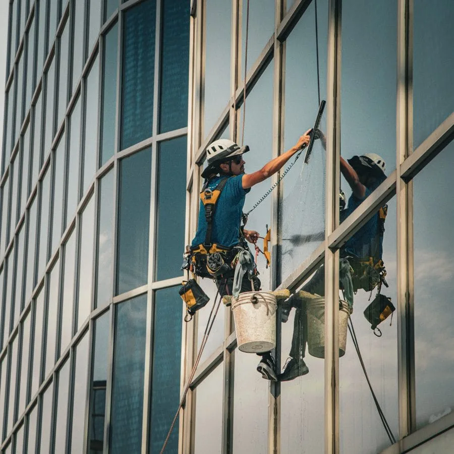 TowerCrest rope access technician cleaning exterior glass
