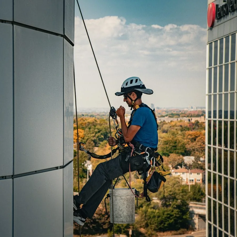 TowerCrest rope access technician cleaning exterior glass